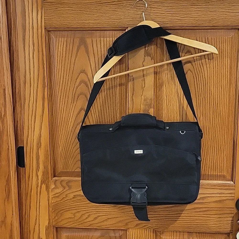 Solo black briefcase with a pullout sleeve for your laptop in black.