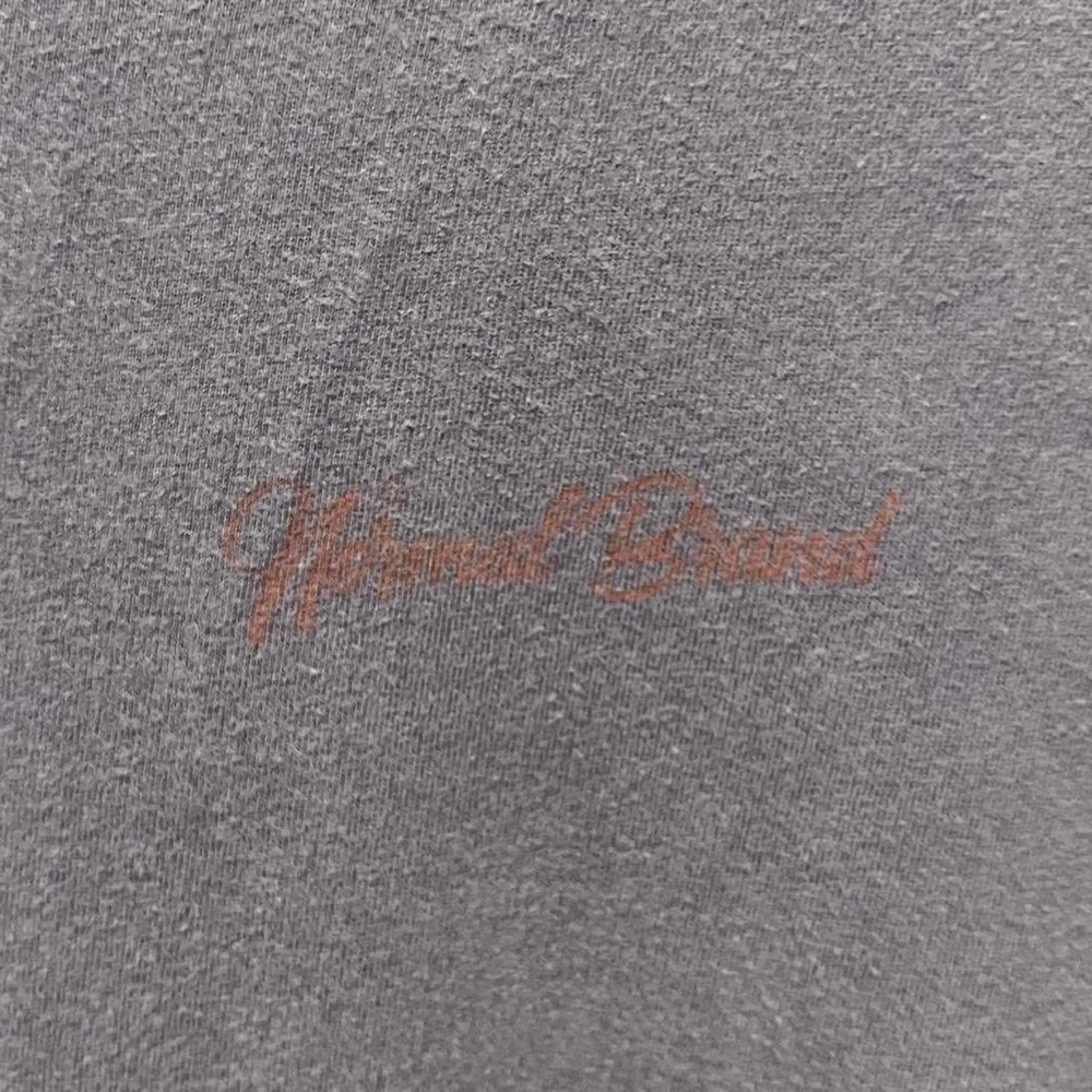 The Normal Brand description hand