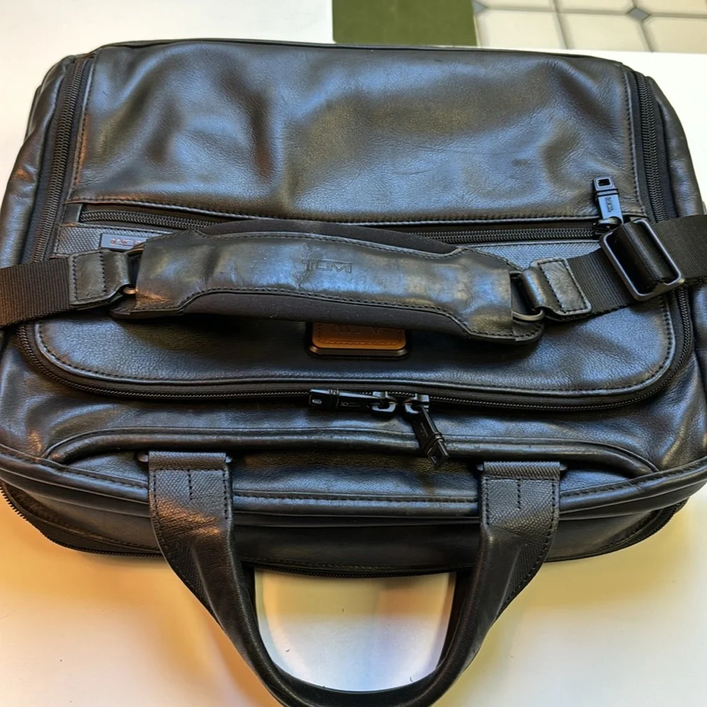 TUMi black leather computer briefcase carry-on VGC long strap multiple pockets