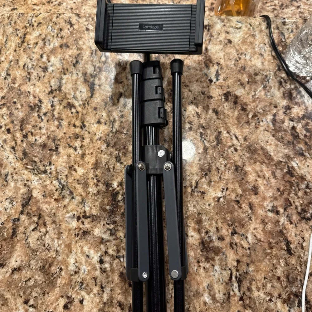 Adjustable Black Tripod Stand for Cameras and Tablets