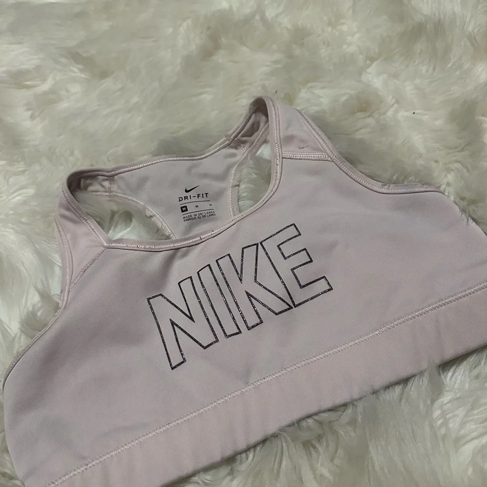 Nike Women's Light Pink Sports Bra with glitter logo. Has tiny stitch pictured!