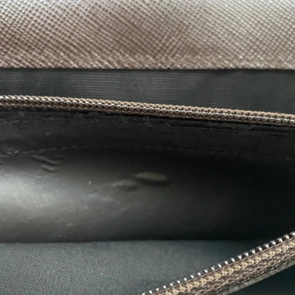 Salvatore Ferragamo Deep brown leather wallet with gold accent