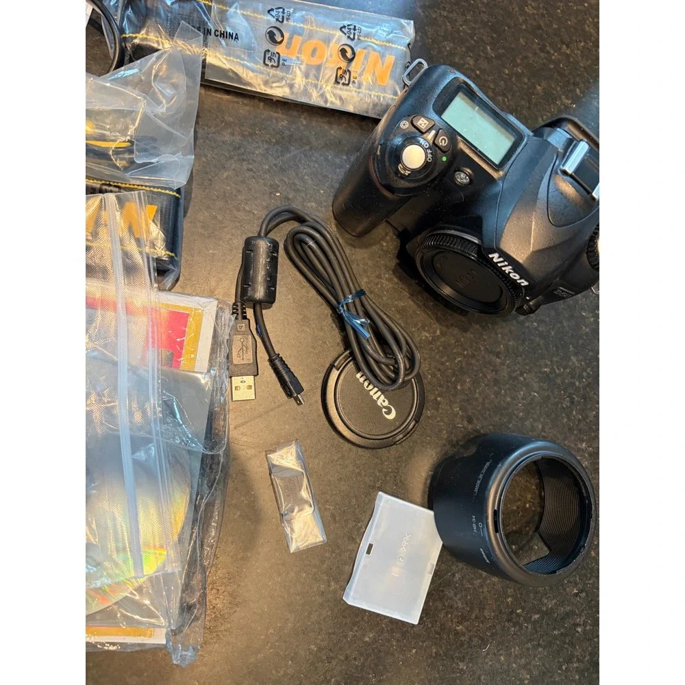 Nikon D50 DSLR camera with accessories charger, strap, cables, manual lens