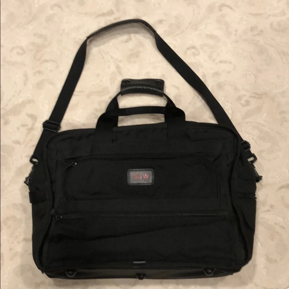 Tumi expandable crossbody suitcase/briefcase