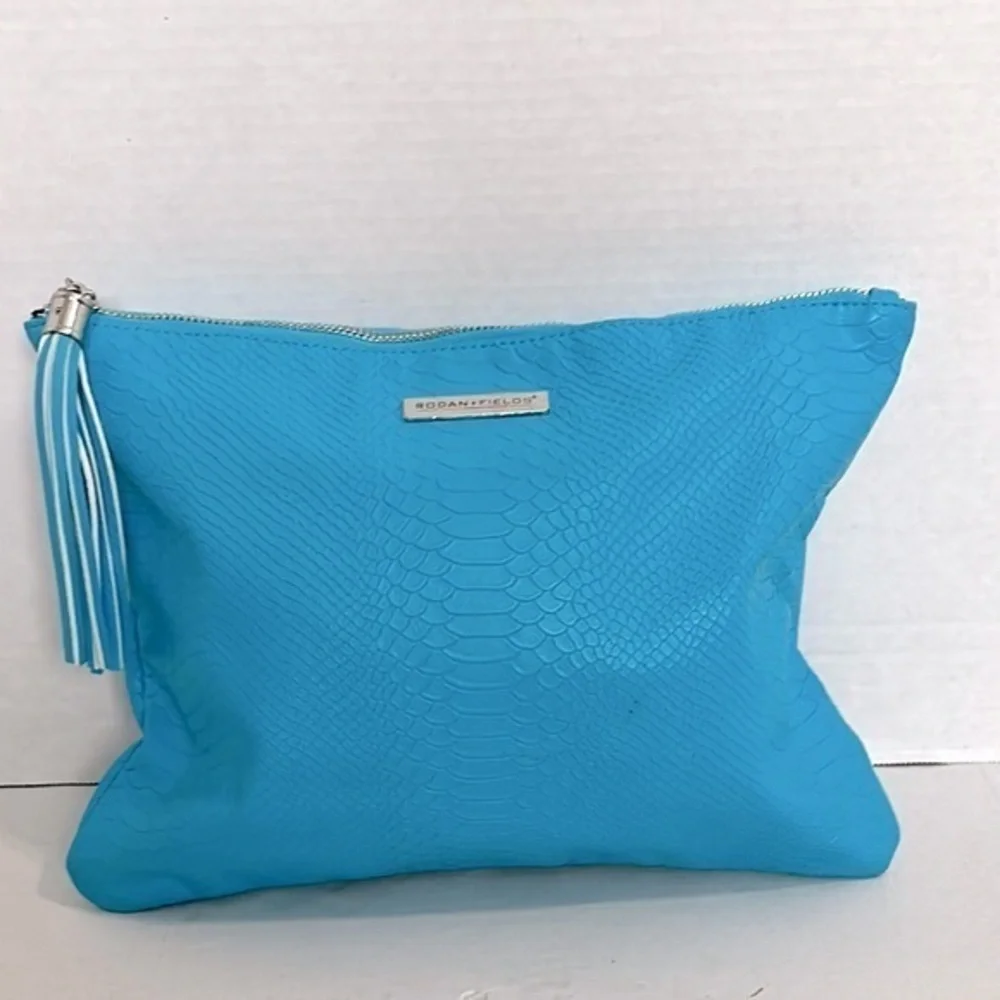 Vibrant Blue Rodan + Fields snake print Cosmetic Bag with Decorative Tassel