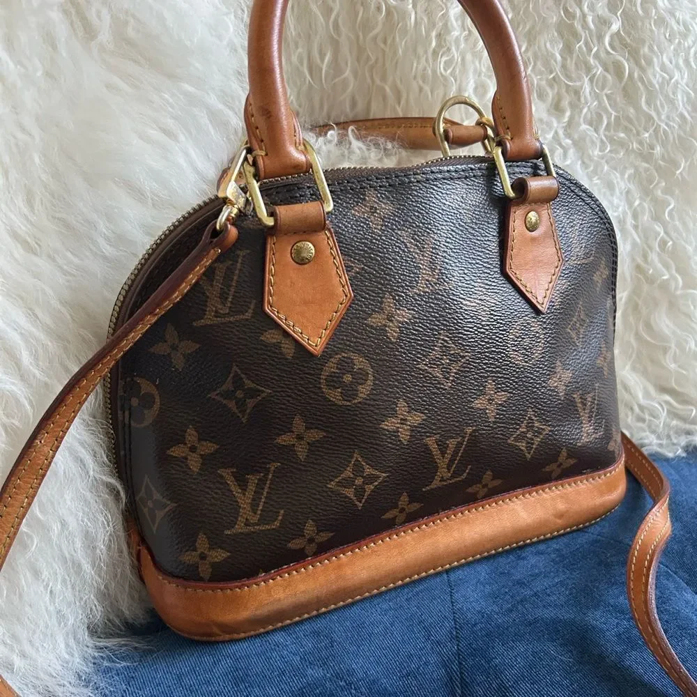 Louis Vuitton Alma bb leather handbag