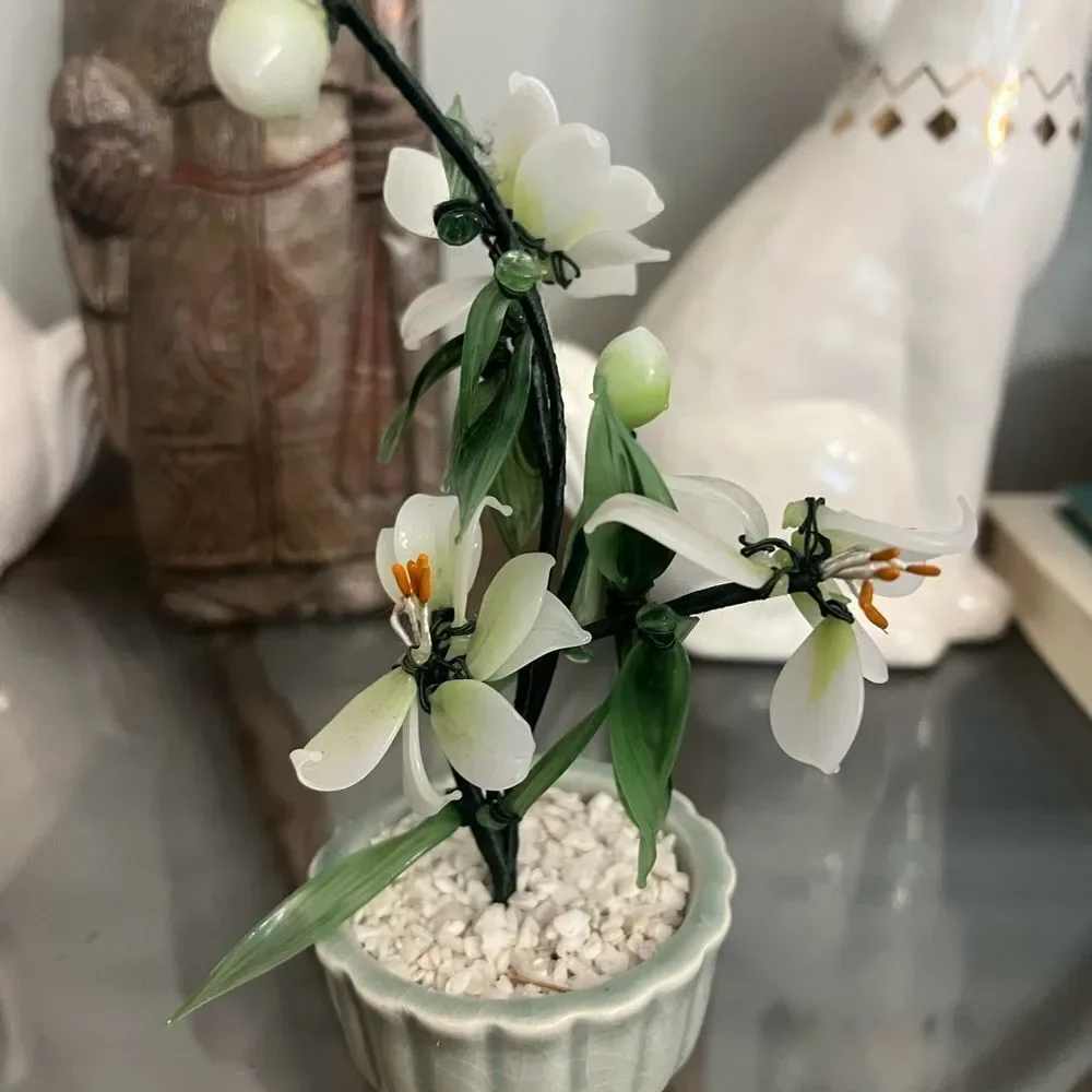 Vintage jade quartz tree in celadon pot. White and Green Plant.