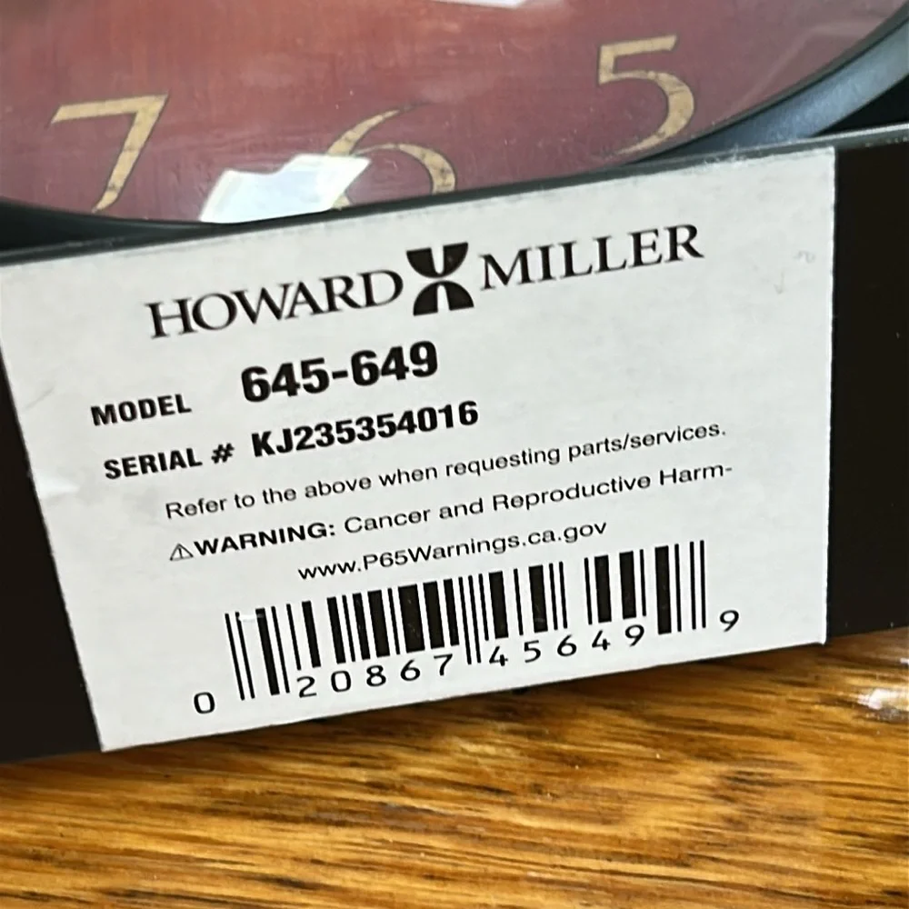 Howard Miller Red Dial Black Metal Table Clock