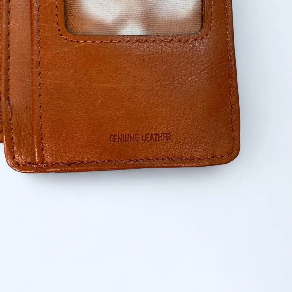 Brown leather wallet with multiple card slots and a zippered compartment