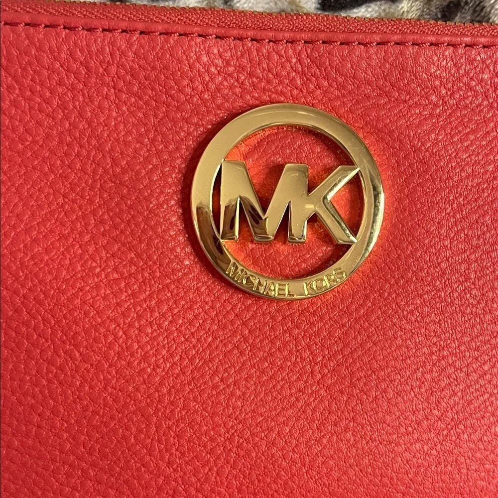 Michael Kors Coral Wristlet with Gold Logo