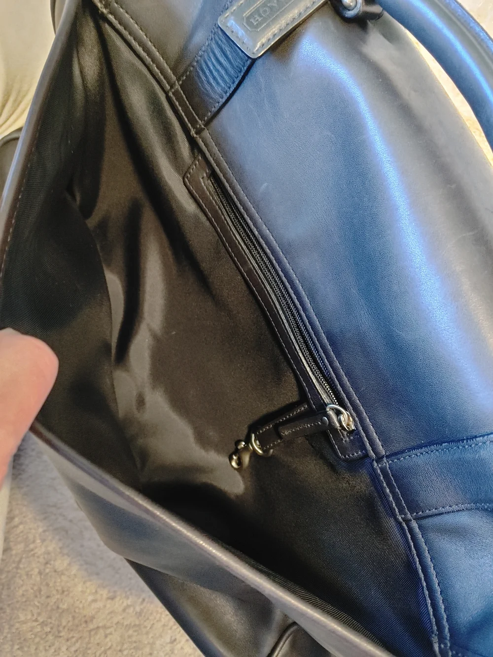 Coach cleaned flap buckles