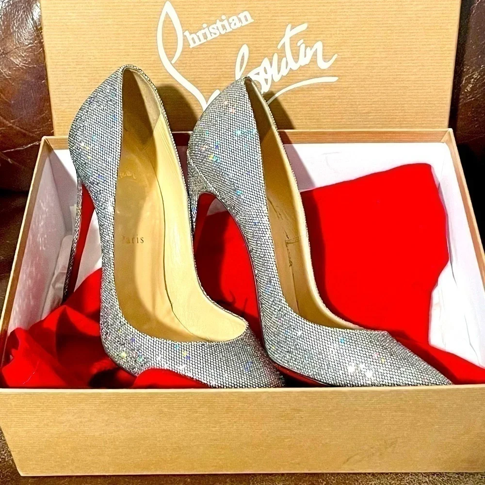 Christian Louboutin flashes red