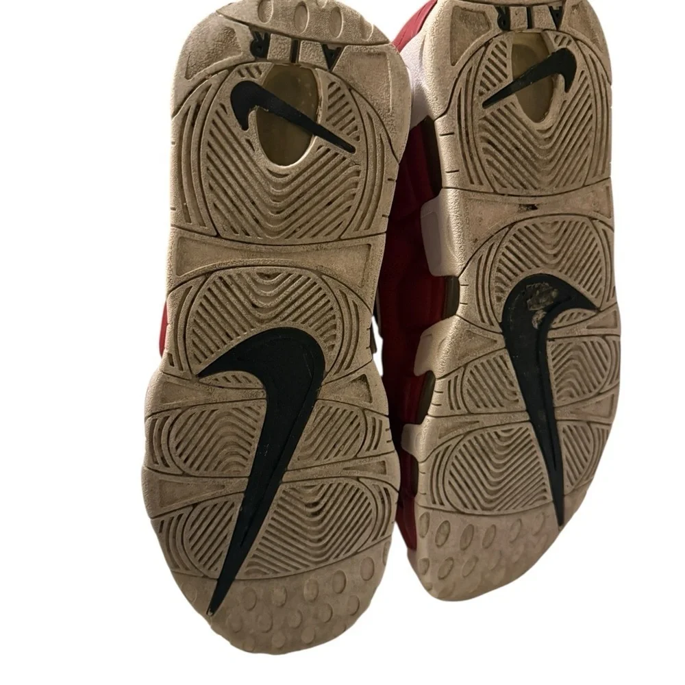 This is a pair of Nike Air More Uptempo '96 basketball shoes in a red, black.