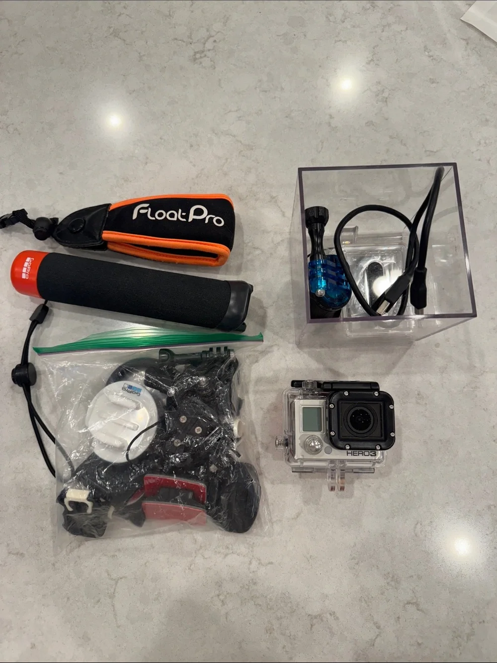 GoPro HERO3 Silver Action Camera with Orange and Black Float Pro Grip and Mounts