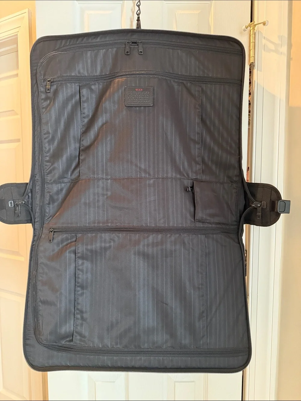Tumi Black Fold-Open Garment Bag with Multiple Zip Pockets