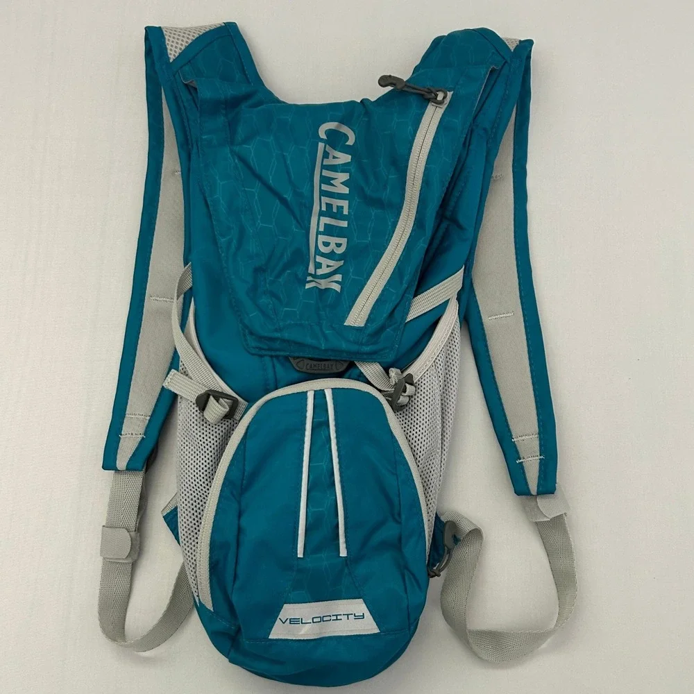 CamelBak Velocity Hydration Pack Teal Blue Reflective Hiking Running Bag 70oz
