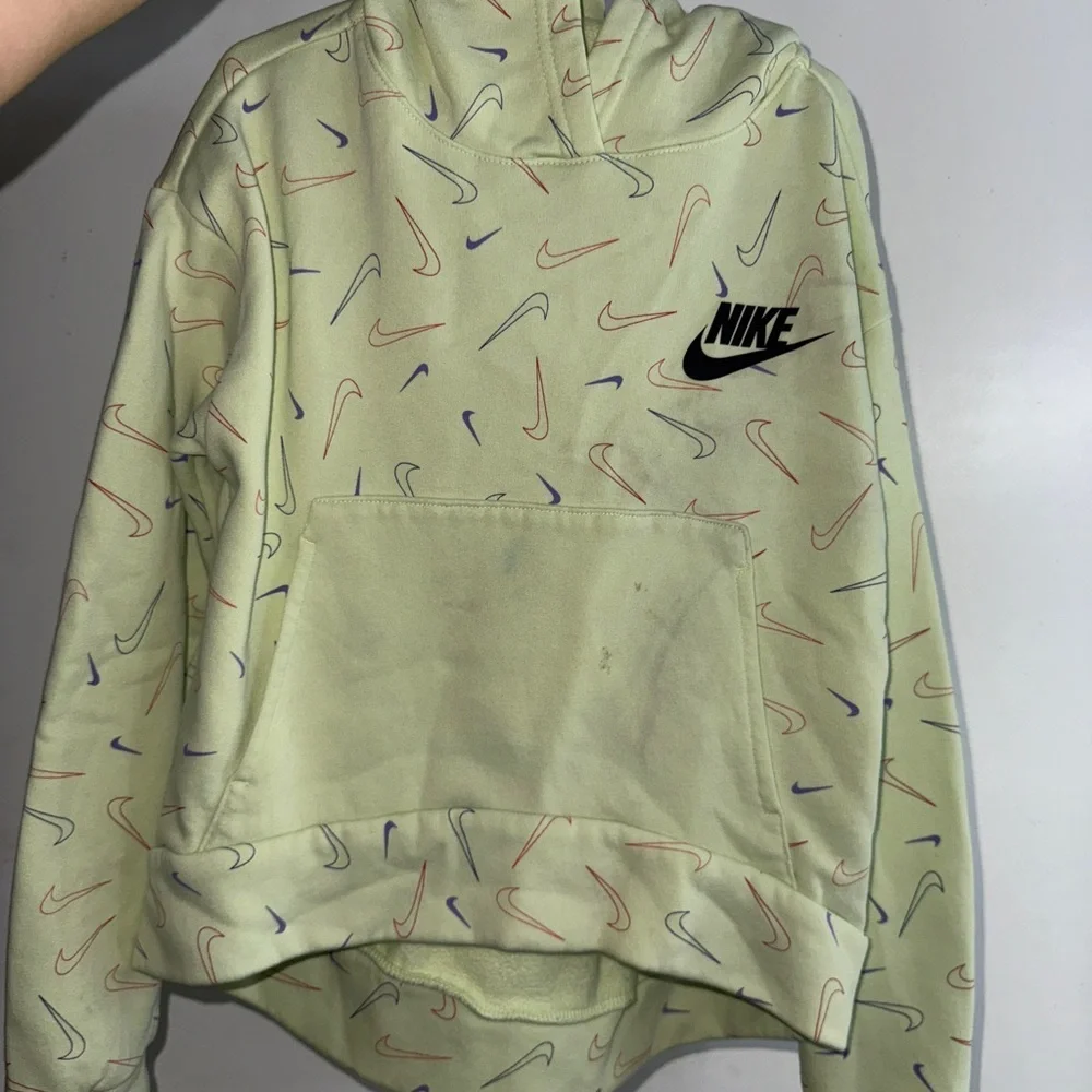 2/$15 Nike Green Hoodie with Multicolor Swoosh Pattern, minor stains