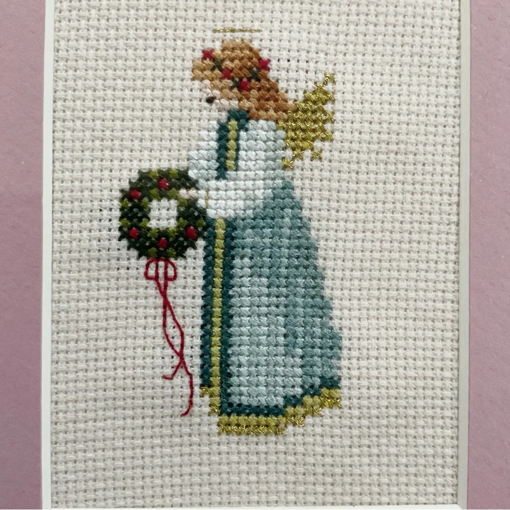 Told in a Garden hand stitched