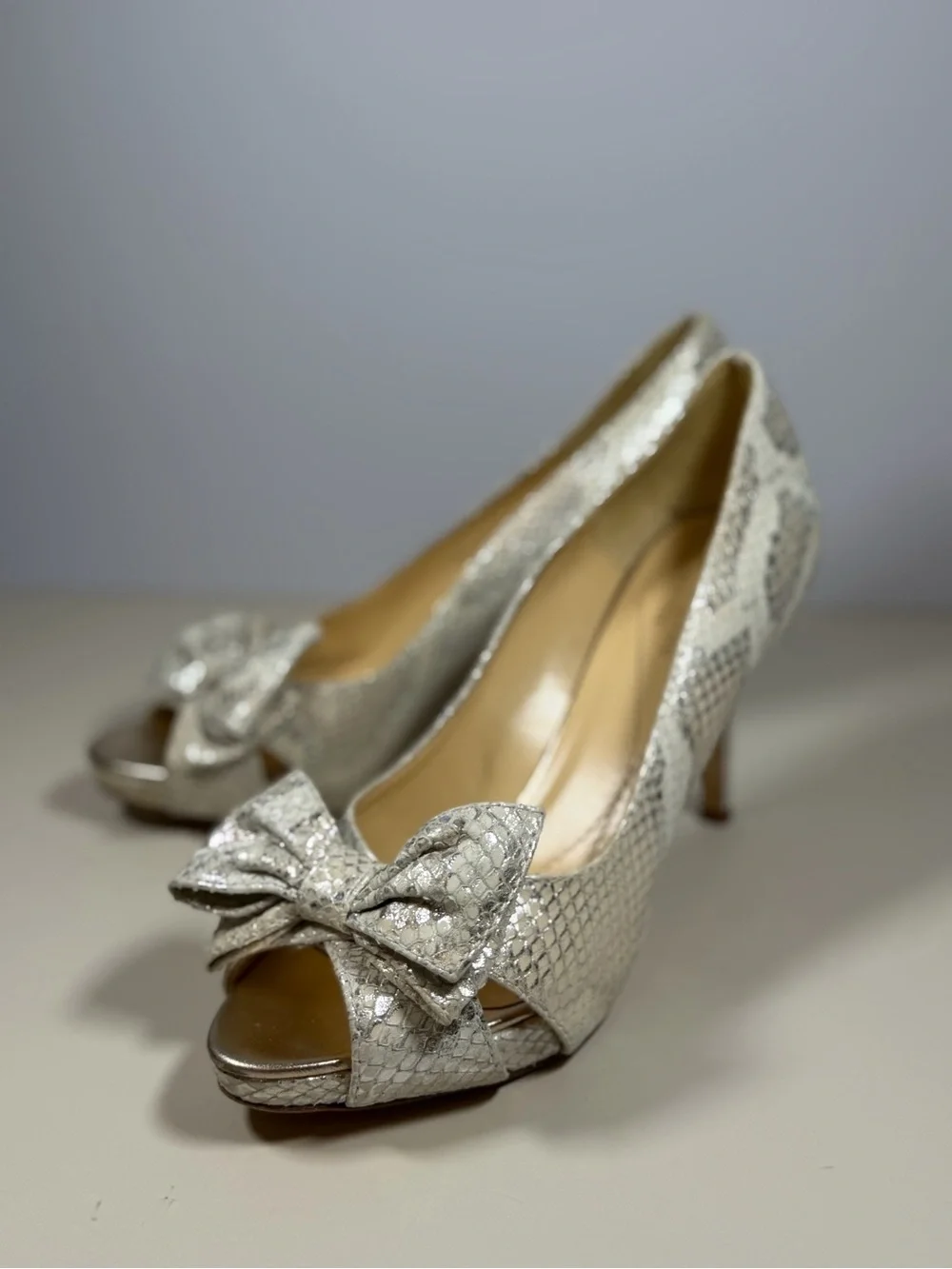 kate spade Silver Snake-Embossed Peep Toe Heels with Bow