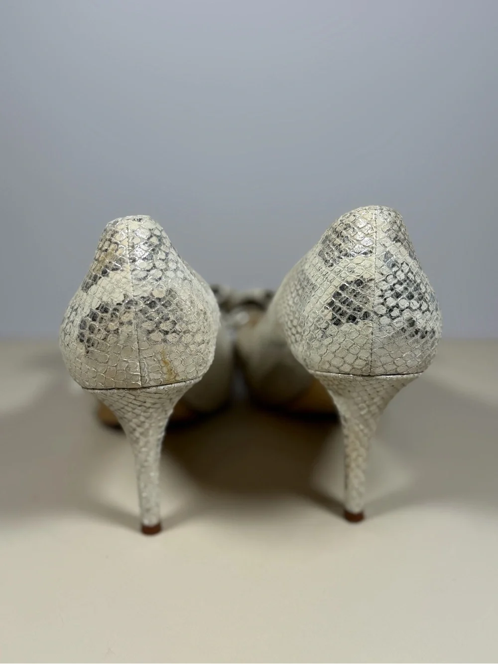 kate spade Silver Snake-Embossed Peep Toe Heels with Bow