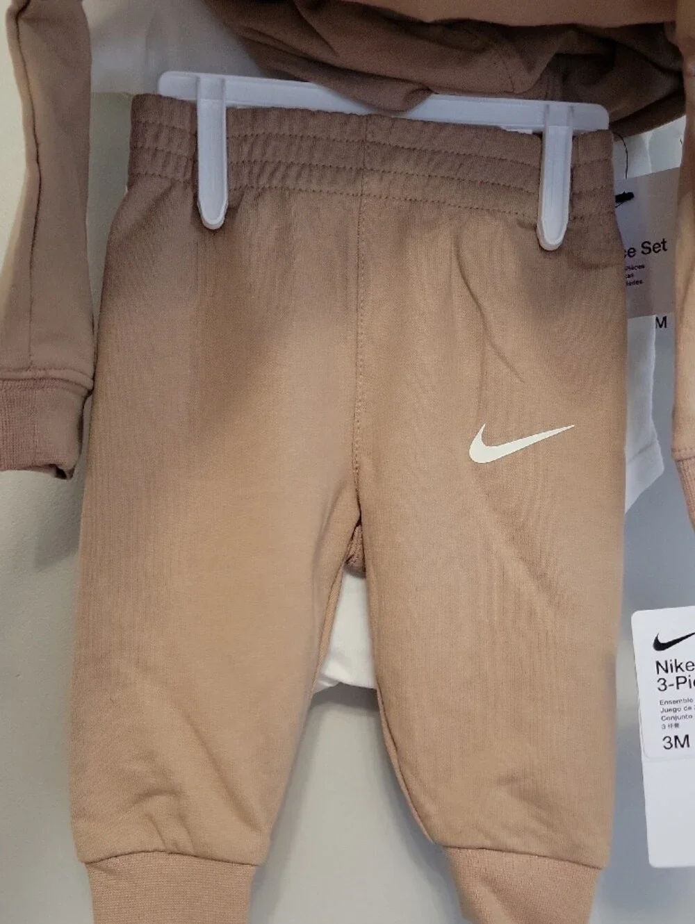 Nike size bodysuit features