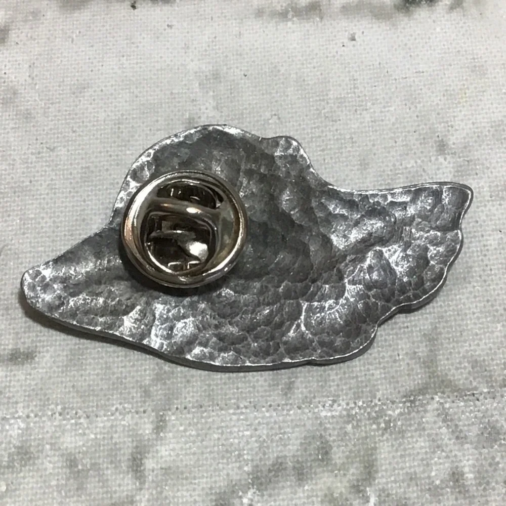 The Unbranded Brand lapel pin