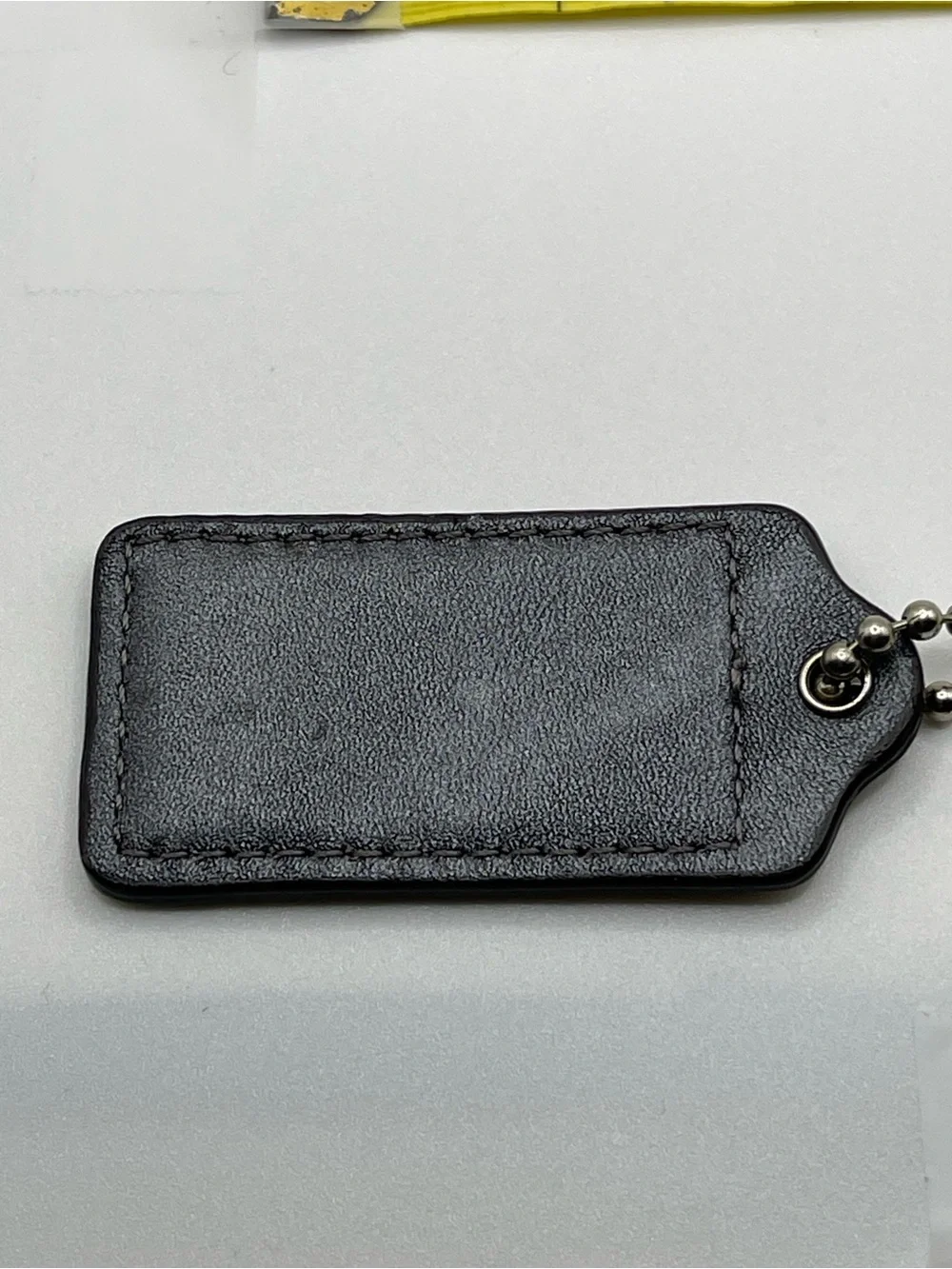 Coach tag embossed chain