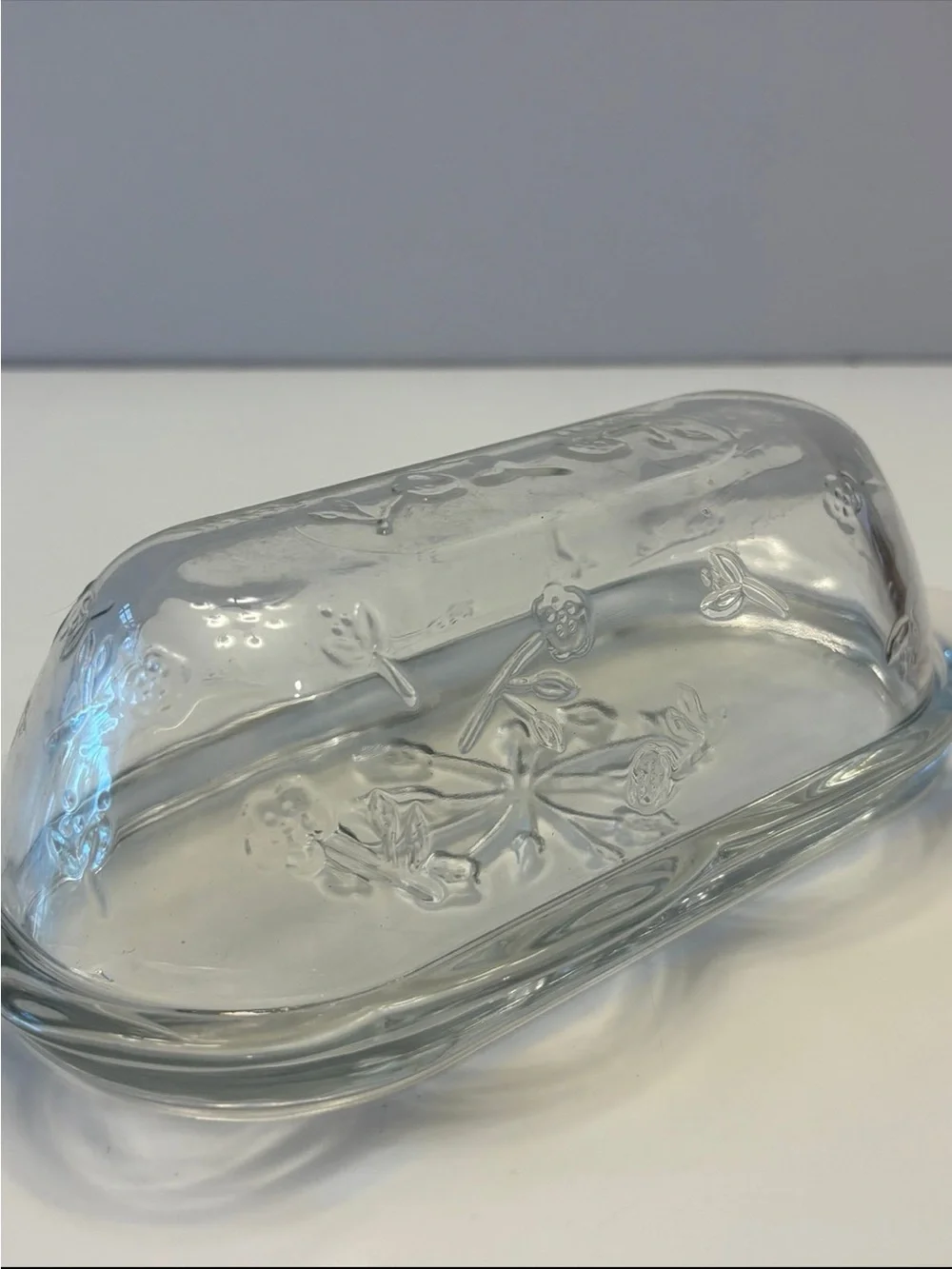 Anchor Hocking Savannah butter dish features a pressed clear glass design flower