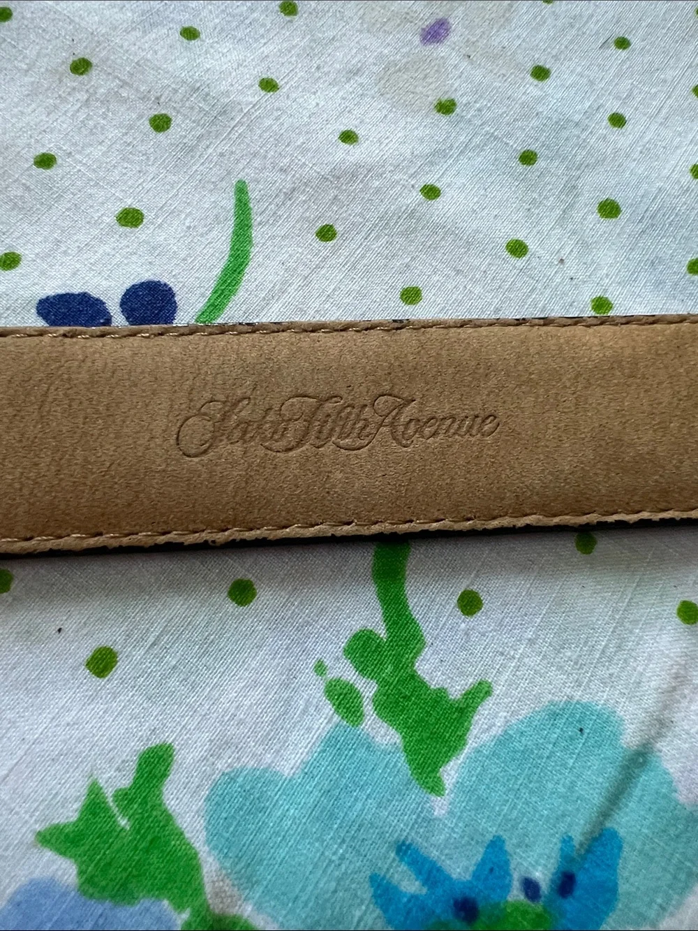 Saks Fifth Avenue holes pictured belt