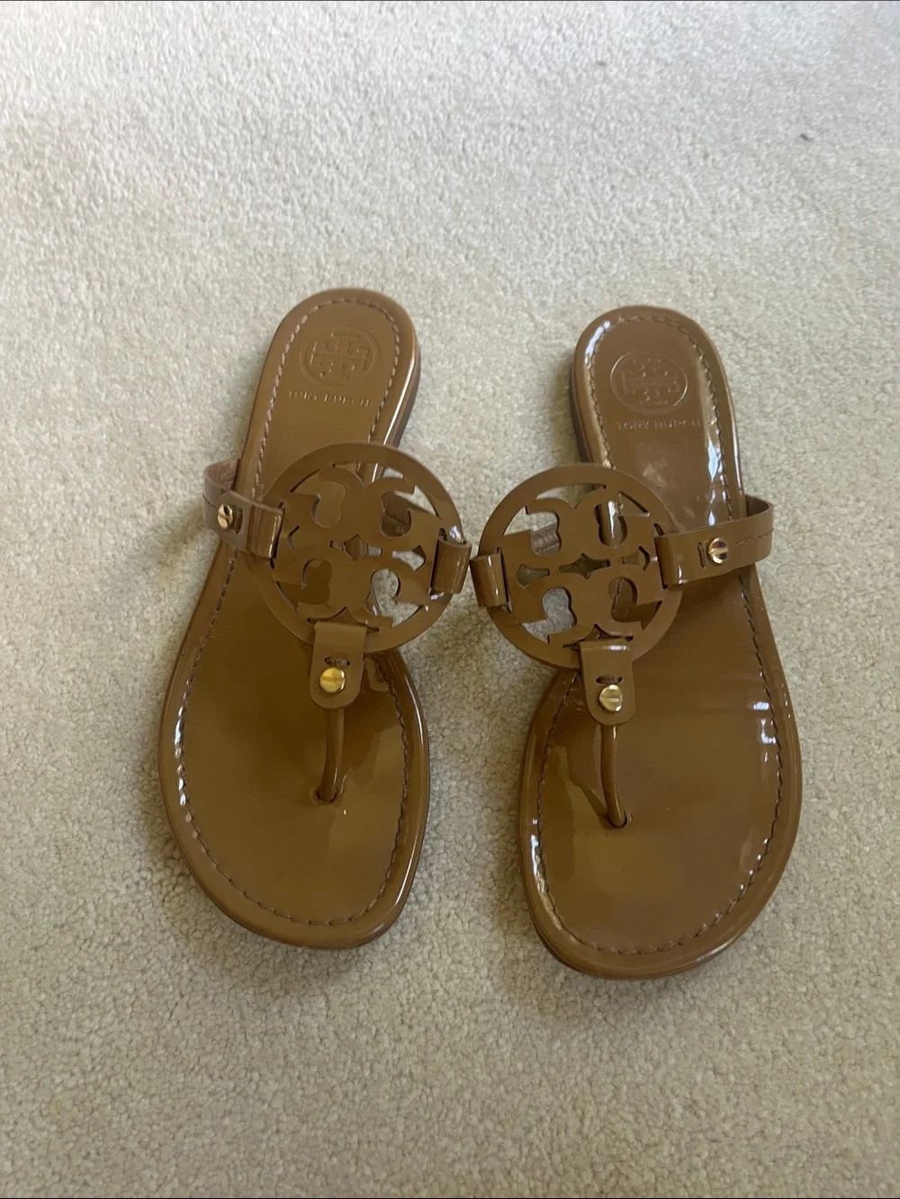 Tory Burch Patent Logo Thong Sandals in Brown