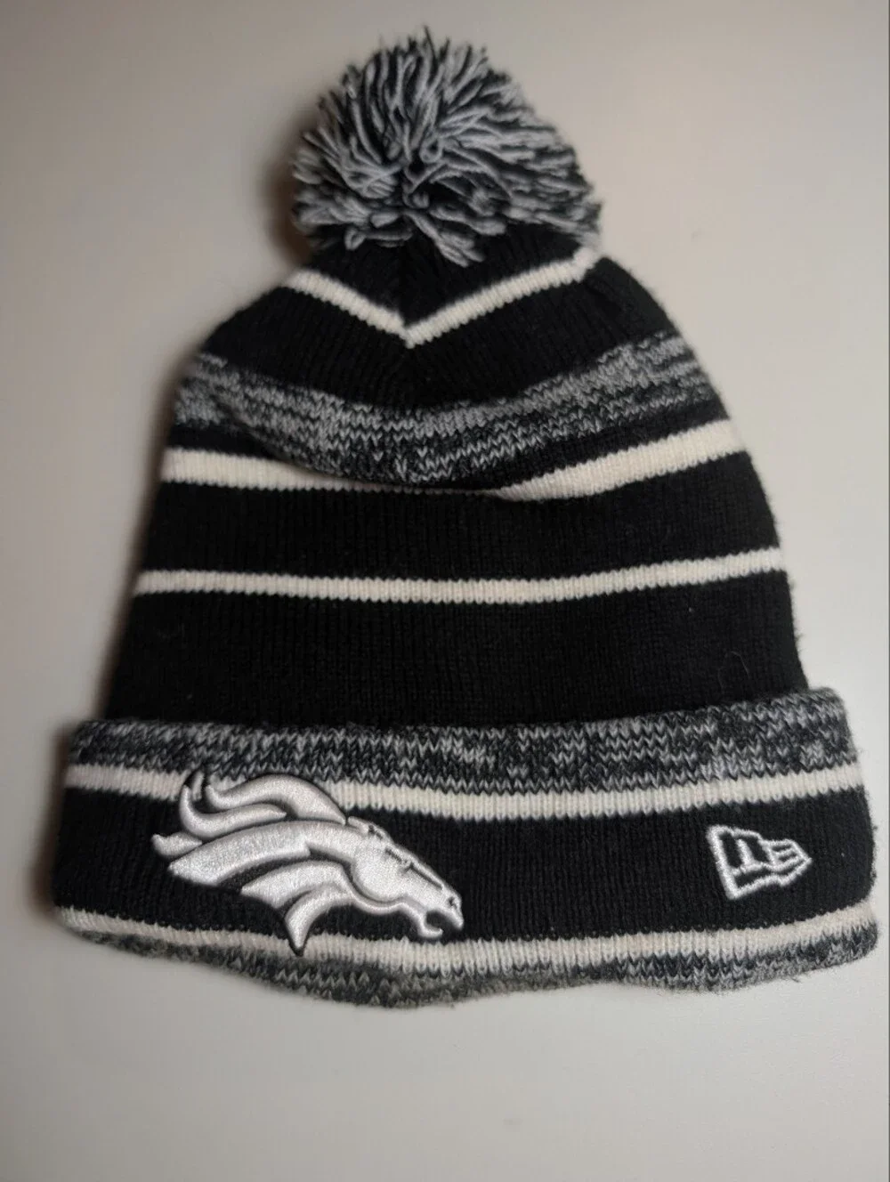 New Era Denver Broncos Black, Gray & White Pom Cuffed Beanie with Team Patch
