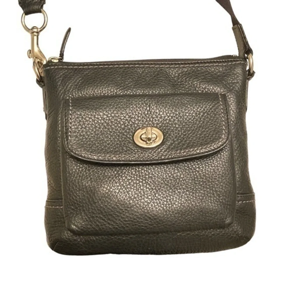 Coach black pebbled leather turnlock swingpack crossbody bag
