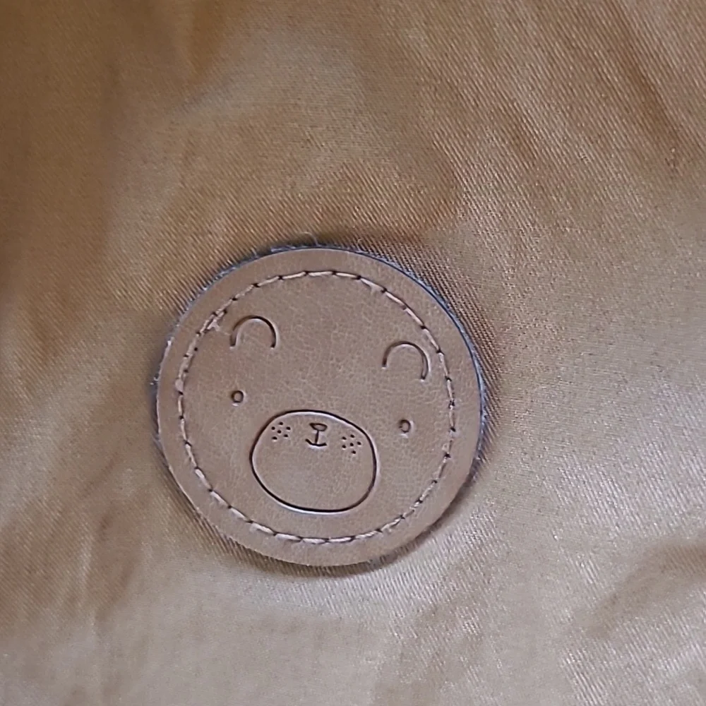 H&M coated emblem