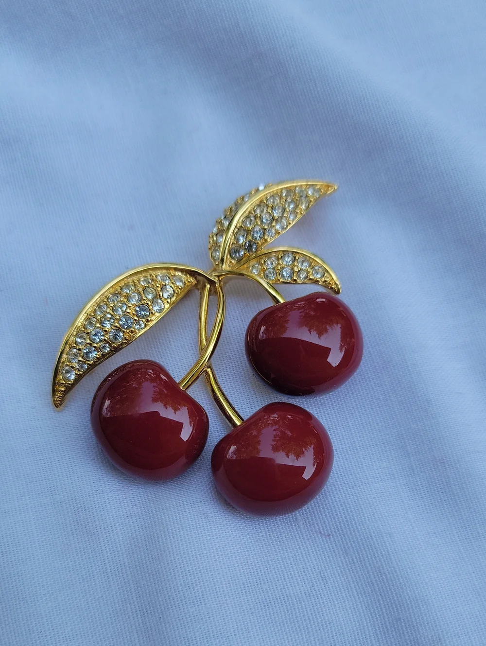 Vintage Joan Rivers Gold-Tone Red Lucite? Cherry Brooch with Crystal Leaves