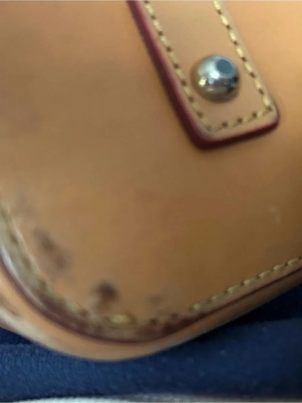 Dooney & Bourke Tan Drawstring Leather Serena  with Red Trim and Tassel