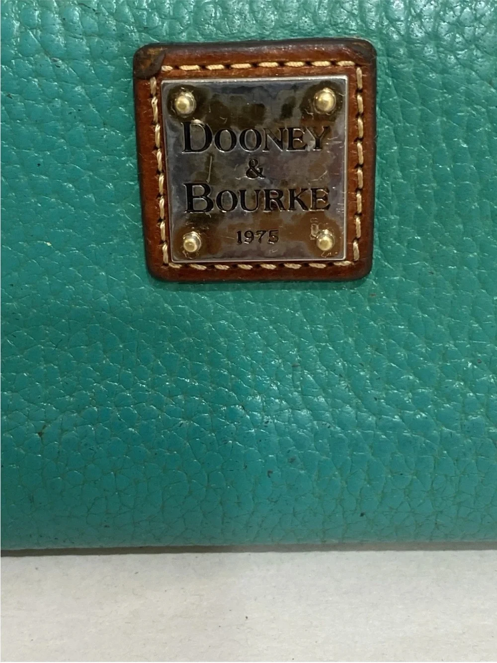 Dooney & Bourke minor signs