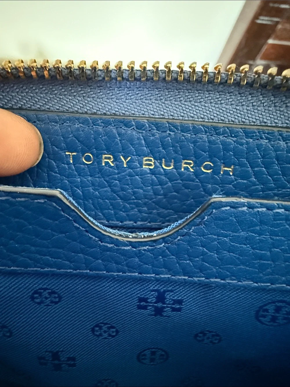 Tory Burch compact wristlet