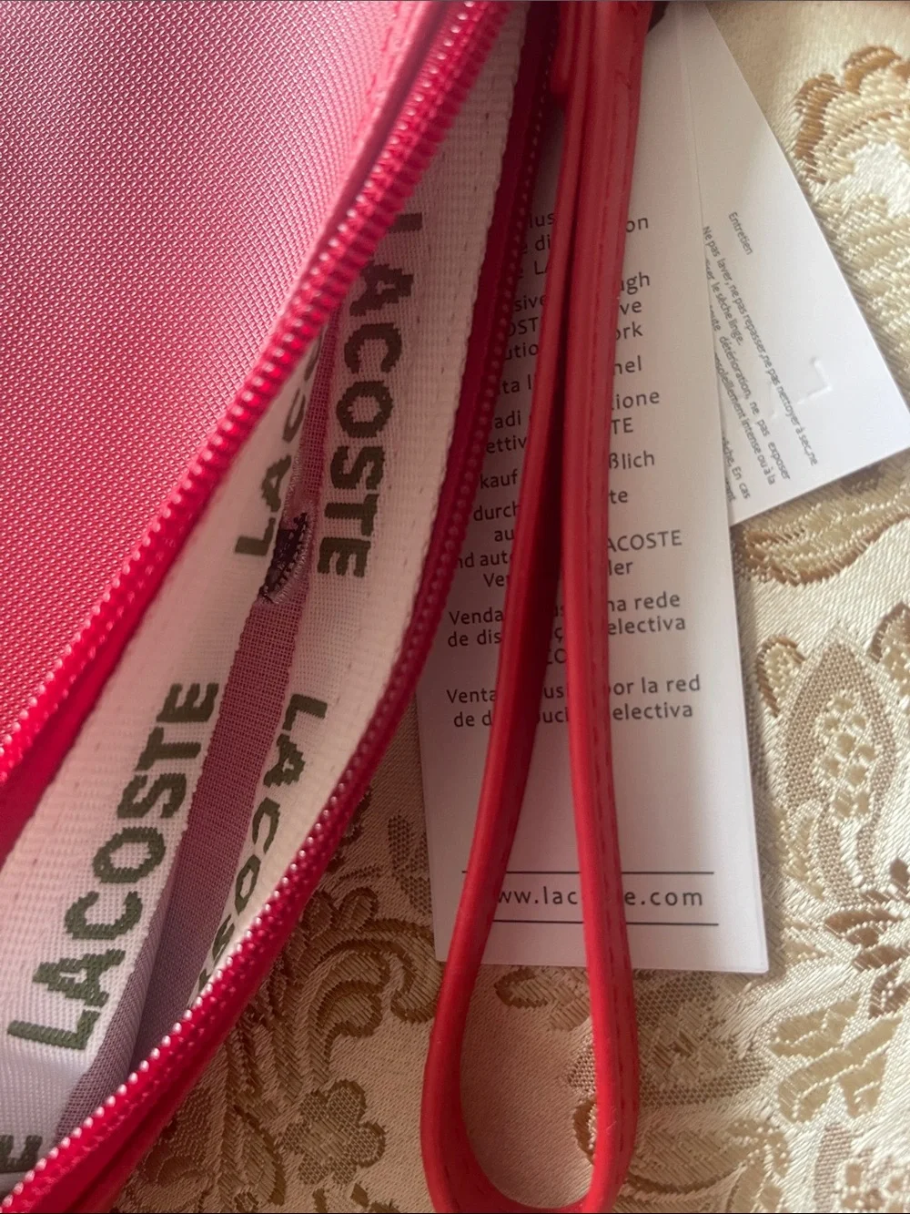 Lacoste compact wristlet