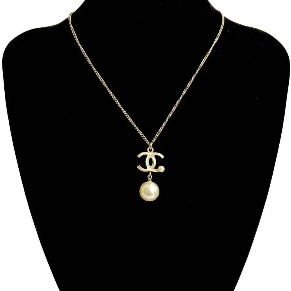 CHANEL Gold Pearl Logo Necklace