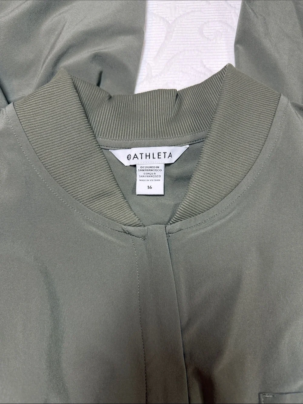 Athleta Brooklyn long sleeve jumpsuit. Size 16 deep green NWT.