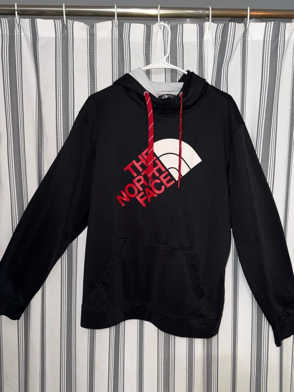 The North Face Black Hoodie with Red Logo and White Arch