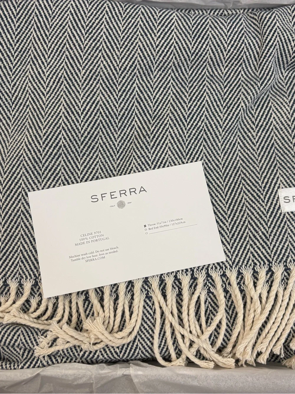 SFERRA “Celine” Navy and Cream Herringbone Throw. NWT. 51x71in. 100% cotton.