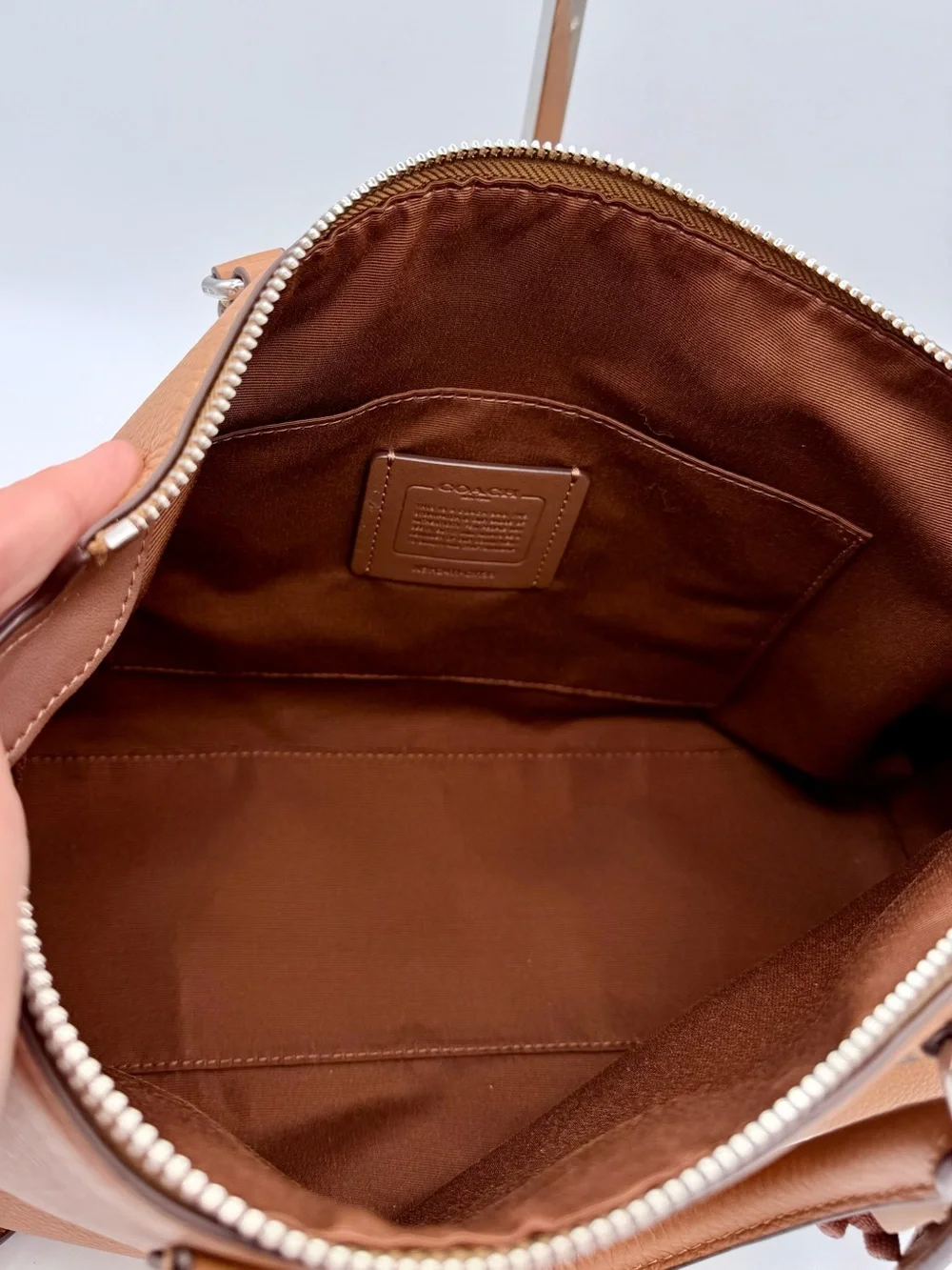 Coach wearing refined cr156