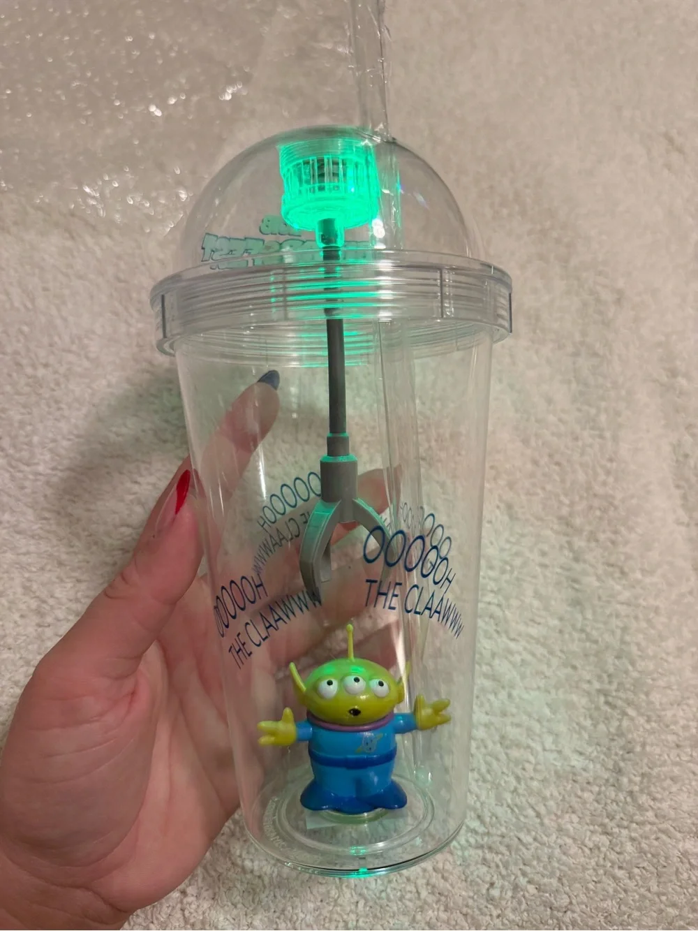 Disney Clear Claw Machine Cup with Green Alien and Blue Outfit