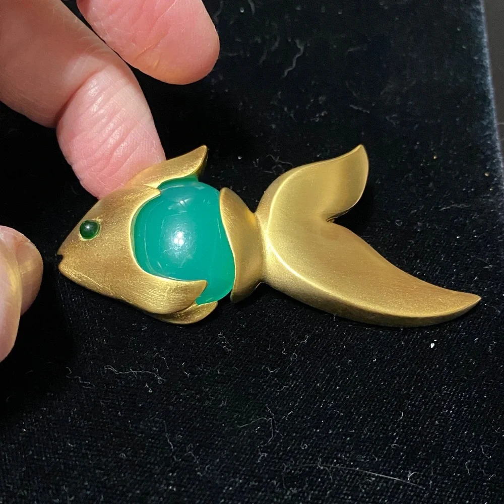 Givenchy vintage Matt gold tone with faux jade belly and eye brooch