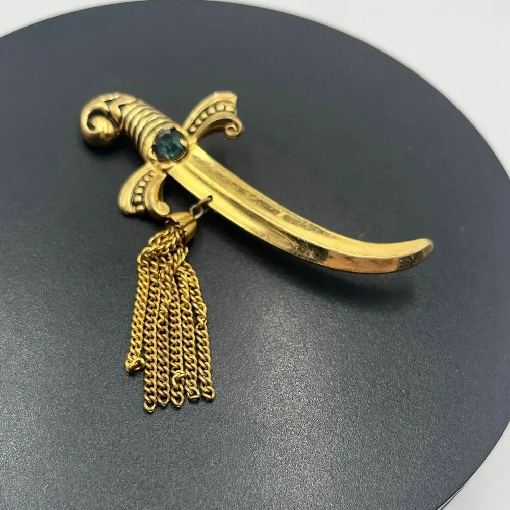 Coro Vintage Signed Gold‎ Tone Sword Dagger Brooch With Tassels and Green Stone