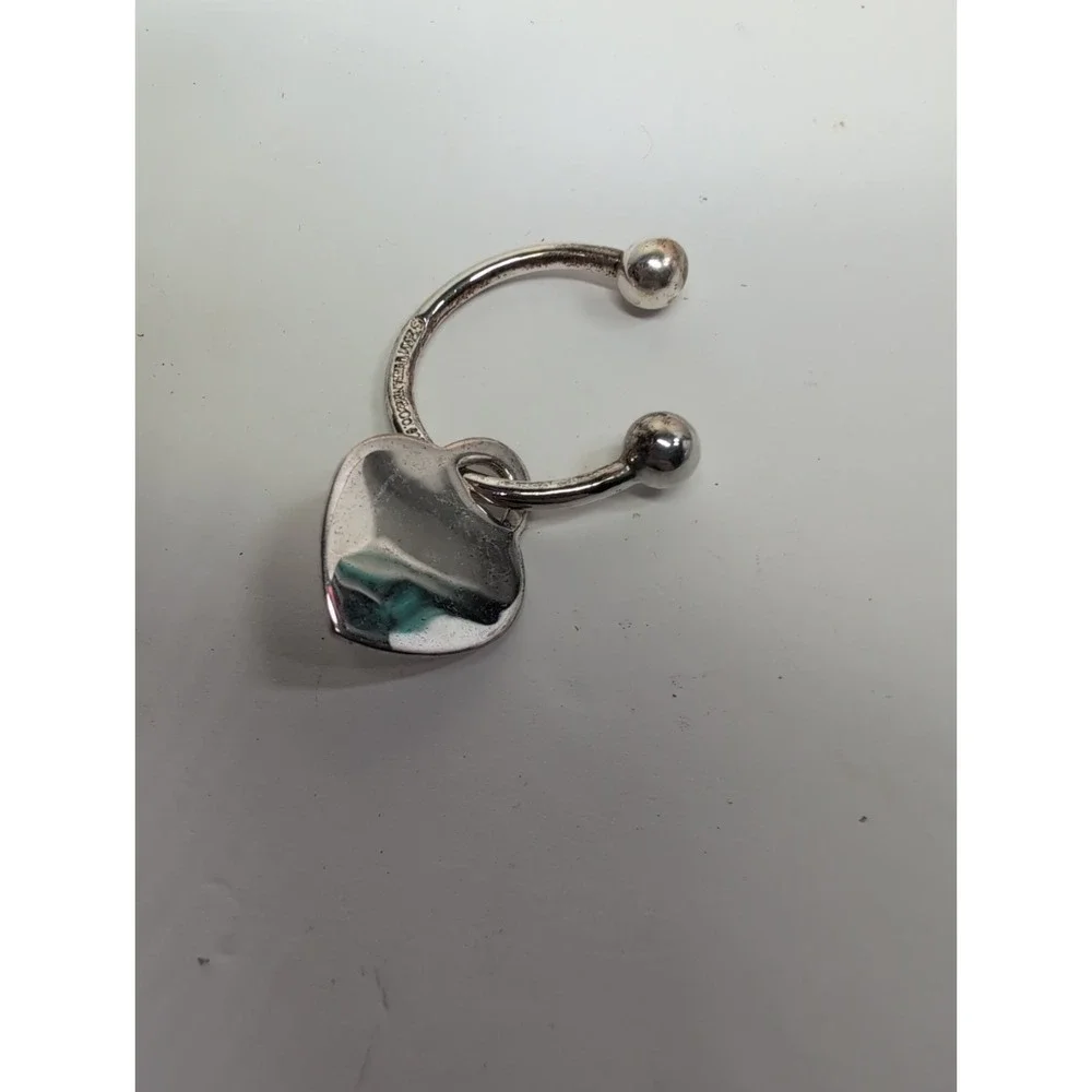 PLEASE RETURN TO TIFFANY & CO. 2001 HEART KEYCHAIN TWIST