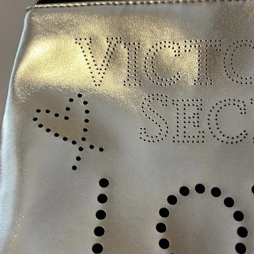 Gold Victoria’s Secret cosmetics/ small carrying bag with handle, studded heart