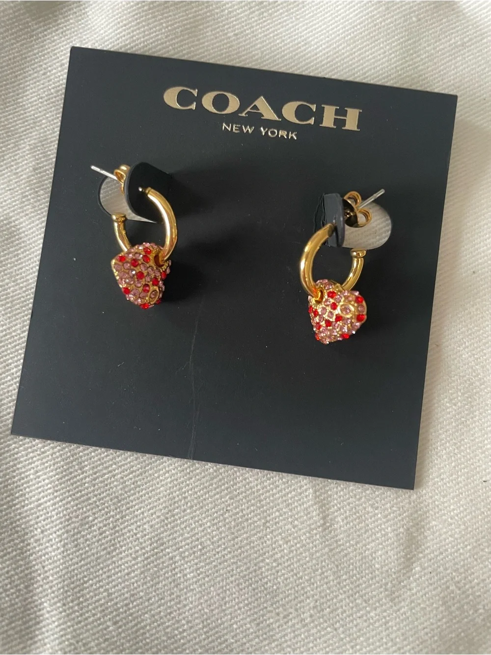 Coach gold tone