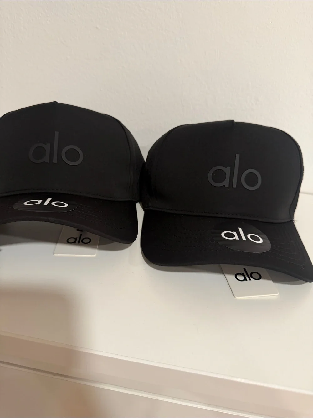 ALO Yoga Black Logo Trucker Hat